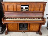 a piano that is sitting outside in the street