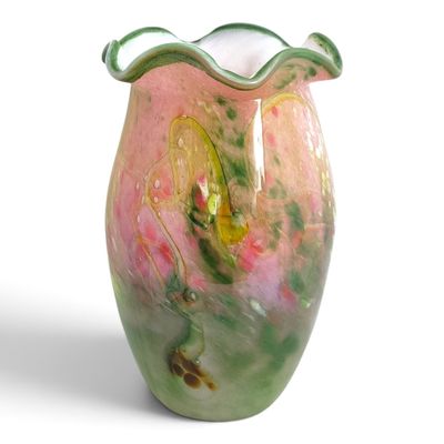 a vase that has a green and pink design on it