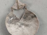 silver plated pendant with a bird on a branch and a bird on a branch