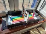 a cardboard box that has a picture of a rainbow on it