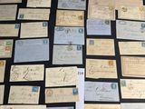 several old letters and envelopes laid out on a table