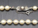 a close up of a row of pearls on a table