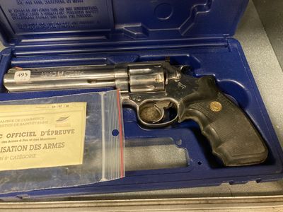 a gun in a blue case on a table