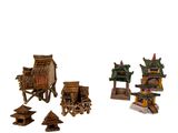 une petite collection de bâtiments asiatiques miniatures sur fond blanc