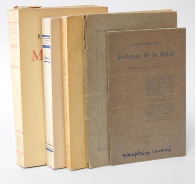three books are stacked on top of each other on a white surface