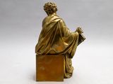 an image of a statue of a man sitting on top of a box