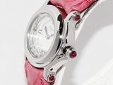 a close up of a wrist watch with a pink strap