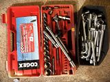 many tools in a red case on the floor