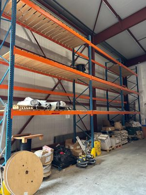 many shelves in the warehouse with various items on them