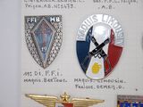 many badges on a piece of paper with writing on it