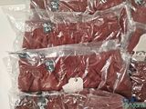 a pile of red underwear sitting on top of each other