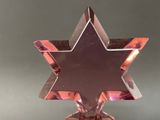 purple glass star of david ornament on a stand