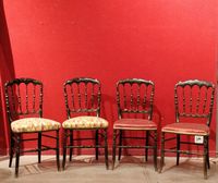 Deux paires de chaises en bois noirci.