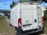 a white van that is parked on the side of the road