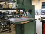 a machine that is sitting in a building with tools