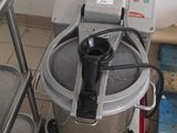 a machine that is sitting on a cart in a kitchen