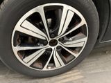 a close up of a tire on a black car