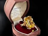 a ring that is in a box on a table