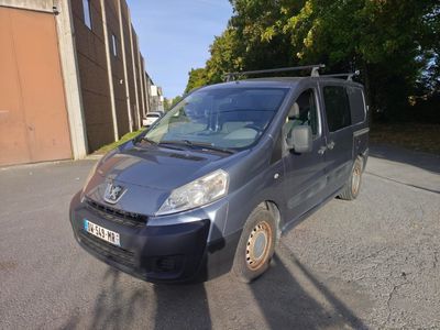 a small van that is parked on the side of the road