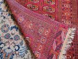 rugs and rugs are laid out on the floor in a room