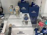 a lot of watches on display in a glass case