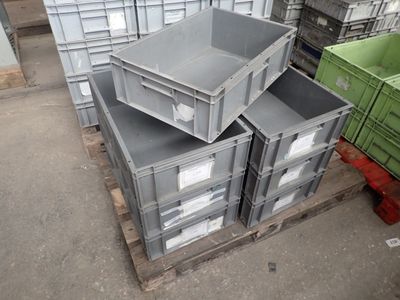 a stack of crates sitting on a pallet in a warehouse