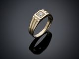 a yellow gold ring with a diamond set in the center
