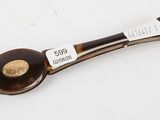 a spoon with a handle that has a label on it