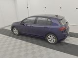 the purple car is parked in the garage on the checkered floor