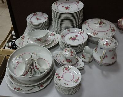 a lot of plates and cups on the table
