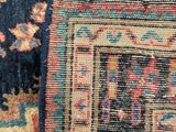 an image of a close up of a rug with a cat laying on it