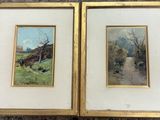two framed paintings of trees and a road in a field