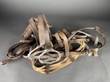 a pile of old shoes that are on the floor