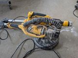 a yellow and black machine that is on the ground