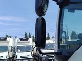 a lot of trucks that are parked in a parking lot