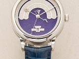 a close up of a wrist watch with a purple dial