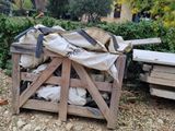 a pile of bags sitting on top of a wooden crate