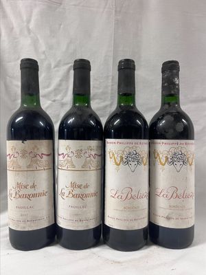 four bottles of wine are lined up on a table
