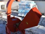 a red machine that is sitting in the snow