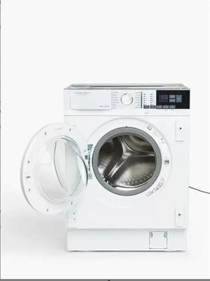 une photo d'une machine à laver dont la porte est ouverte