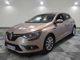 the beige car is parked on a checkered floor in a room