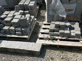 a pile of bricks sitting on a pallet in a yard