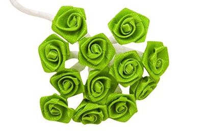 a bunch of green flowers that are on a white table
