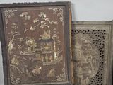 several antique wooden boxes with decorative designs are stacked on top of each other