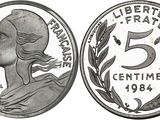 a close up of a coin with a woman ' s face on it
