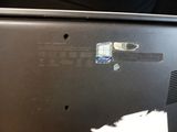 a laptop that has been left on the table with a sticker on it
