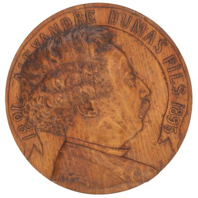 Gros plan sur une pièce de monnaie portant le visage d'un homme