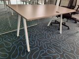 a table with chairs and a chair in a room