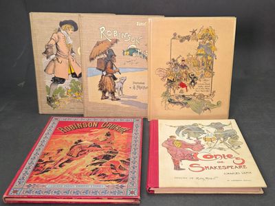 trois livres pour enfants sont alignés sur une surface noire