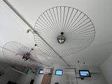 two umbrellas hanging from the ceiling in a room